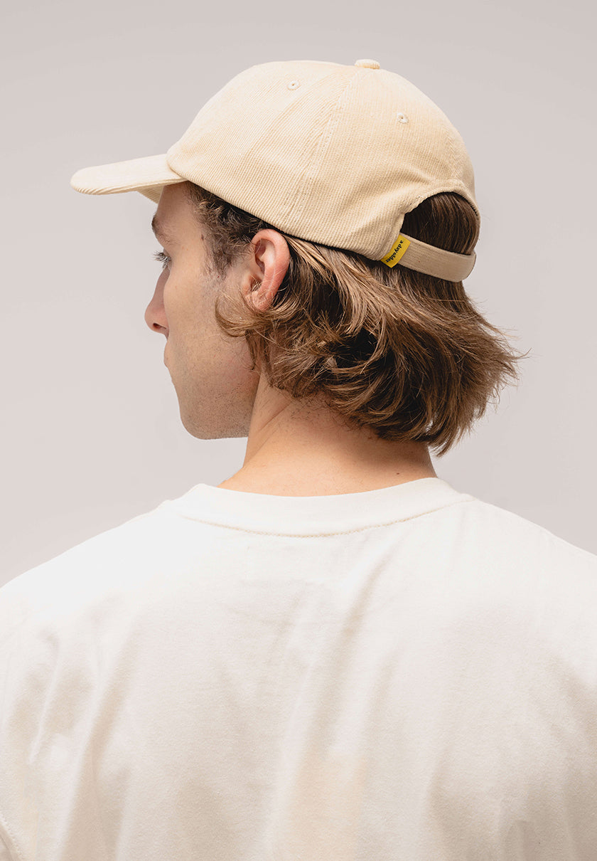 a cream corduroy cap