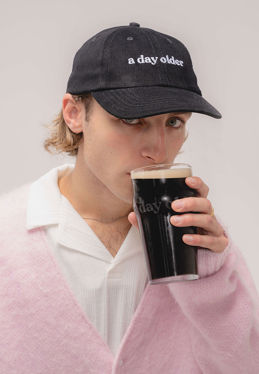 a black corduroy cap