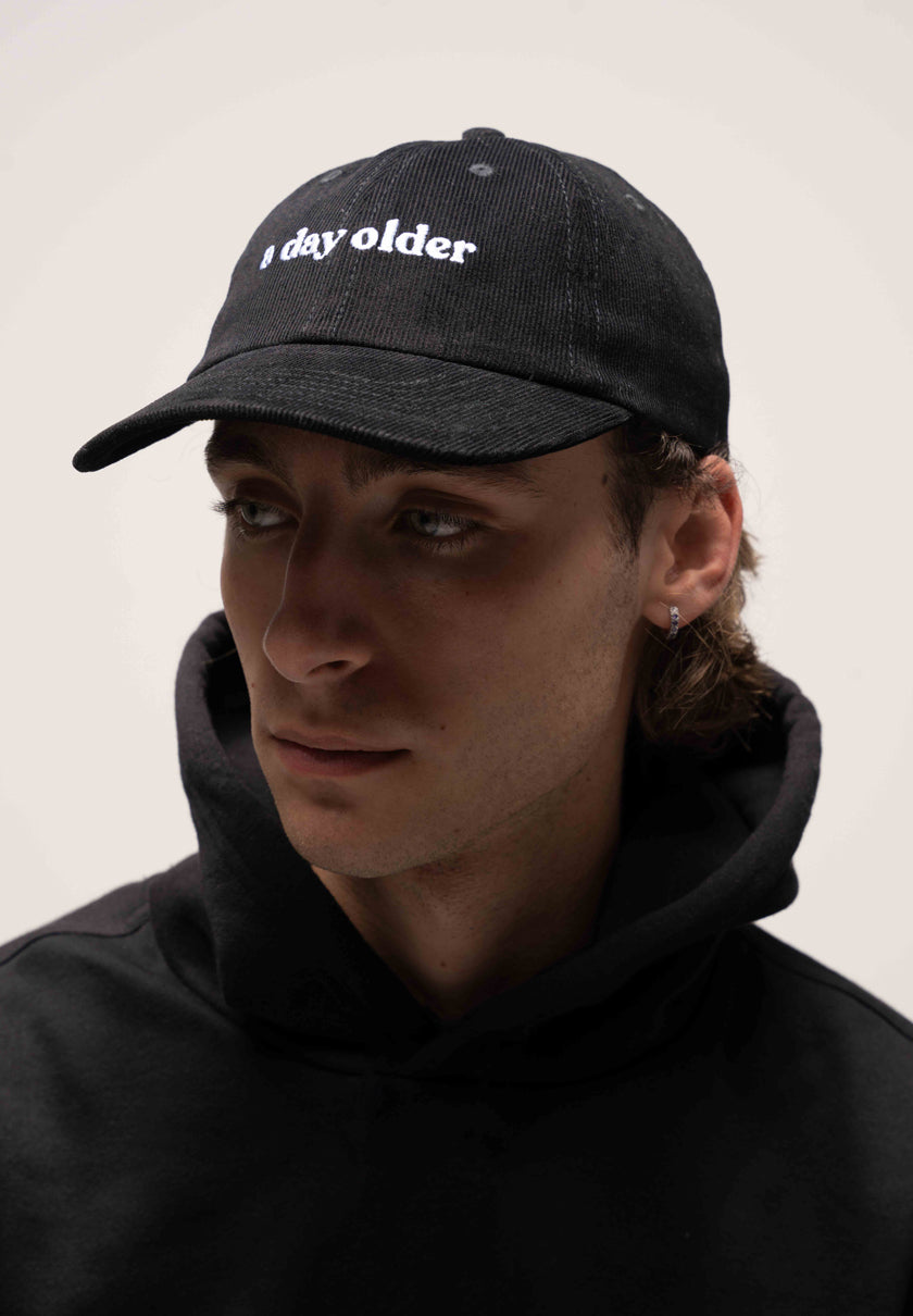 a black corduroy cap