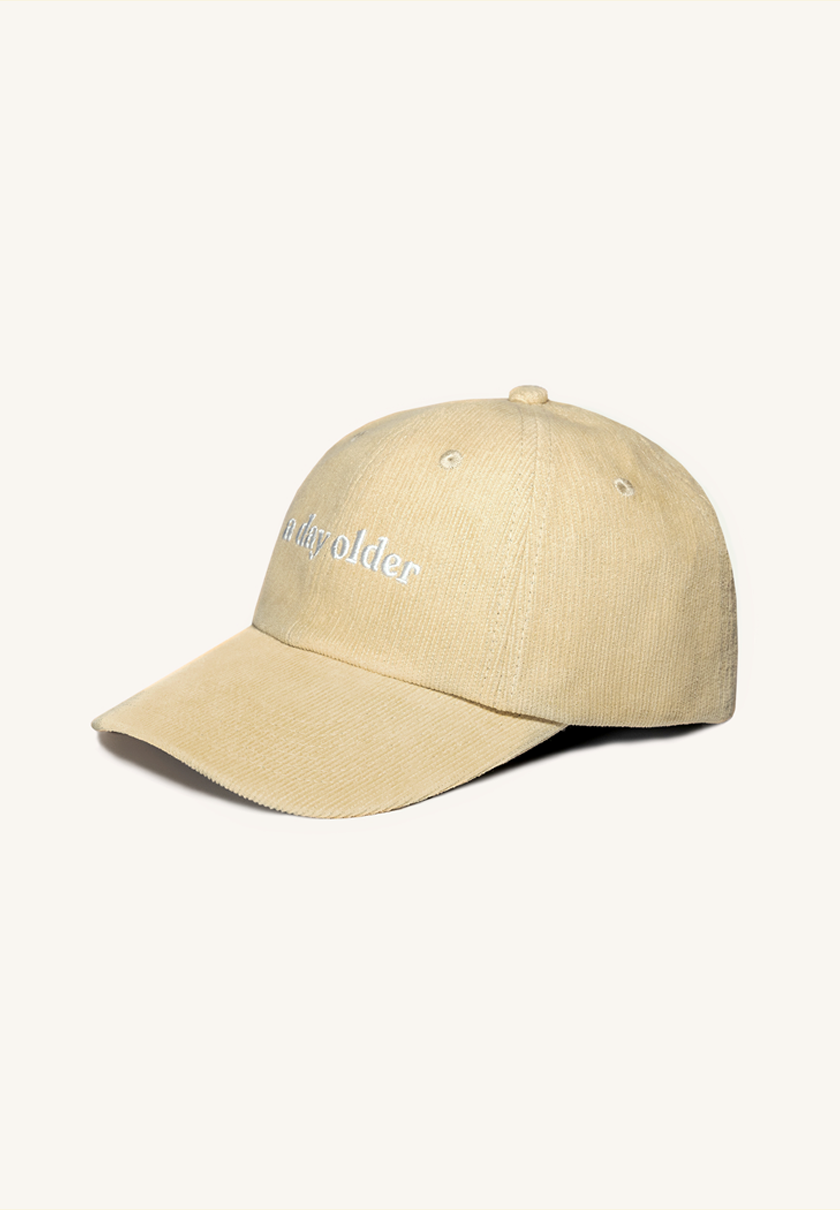 a cream corduroy cap